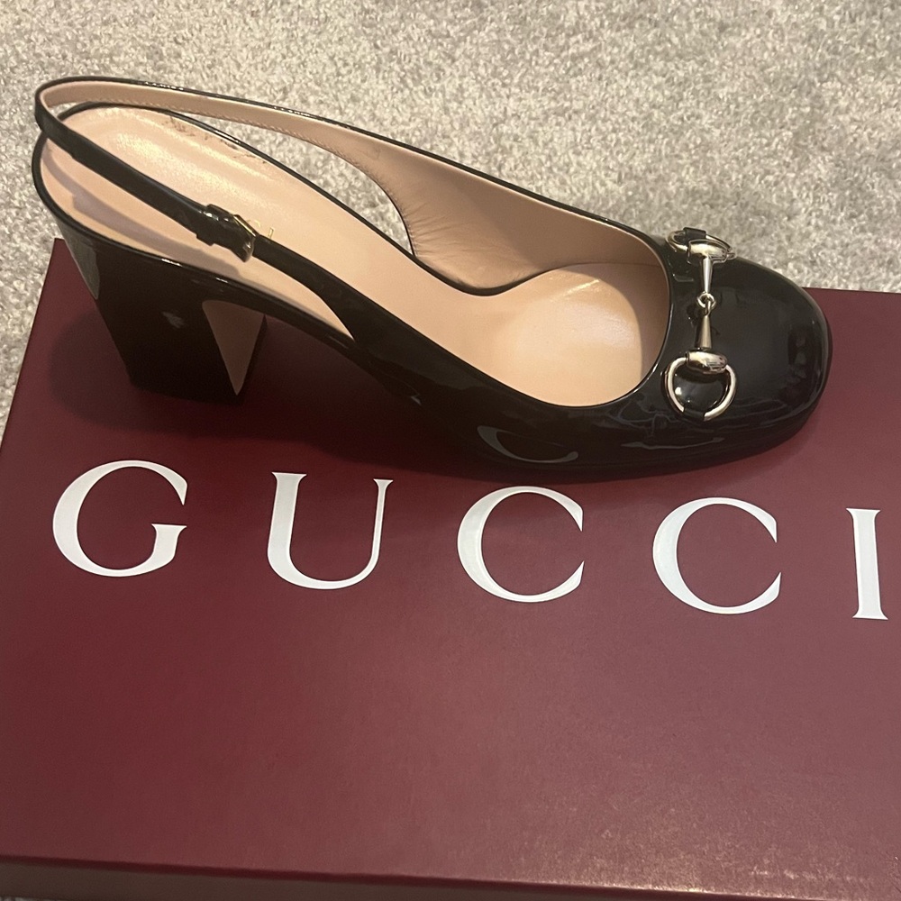 Worn ONE time .. slightly small at the top on my foot.  Stunning shoe!